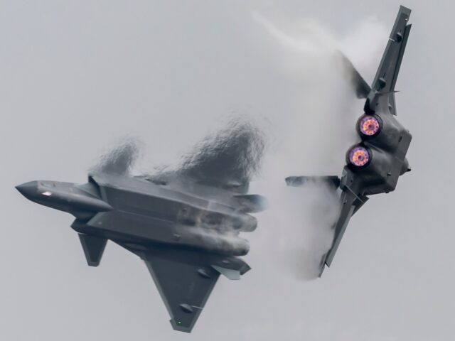 ZHUHAI, CHINA - NOVEMBER 08: J-20 stealth fighter jets perform in the sky on the opening d
