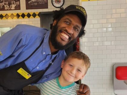 An eight-year-old Arkansas boy helped raise tens of thousands of dollars for his favorite Waffle House server after finding out the man lived in a motel room with his family.