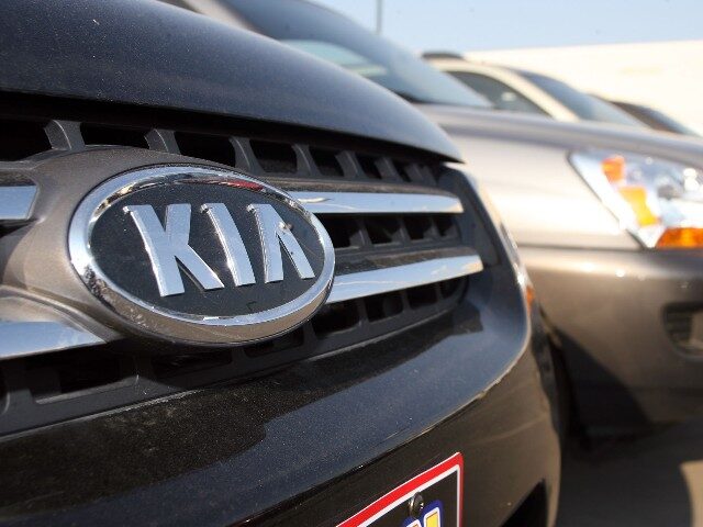 The Kia logo glimmers on the grille of a 2006 Sportage sports utility vehicle on the back lot of a Kia dealership in the west Denver suburb of Lakewood, Colo., on Monday, July 31, 2006. (AP Photo/David Zalubowski)