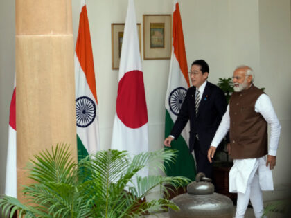 Indian Prime Minister Narendra Modi, right, with his Japanese counterpart Fumio Kishida arrive for their meeting in New Delhi, India, Monday, March 20, 2023. (AP Photo/Manish Swarup)