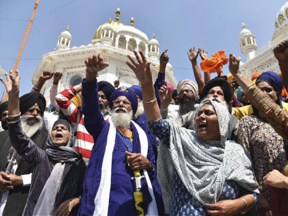 Supporters of Waris Punjab De shout slogans favouring their chief and separatist leader Amritpal Singh and other arrested activists during a meeting at the Akal Takht Secretariat inside Golden Temple complex, in Amritsar, India, Monday, March 27, 2023. Indian police are searching for the separatist leader who has revived calls …