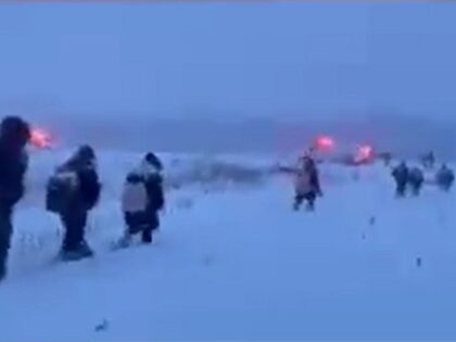 Swanton Sector Border Patrol agents apprehend a group of migrants trekking through the snow as they cross the Canadian border into the U.S. (U.S. Border Patrol/Swanton Sector)