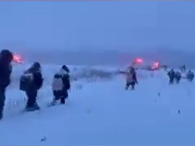 Swanton Sector Border Patrol agents apprehend a group of migrants trekking through the sno