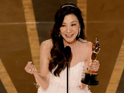 HOLLYWOOD, CALIFORNIA - MARCH 12: Michelle Yeoh accepts the Best Actress award for "Everyt