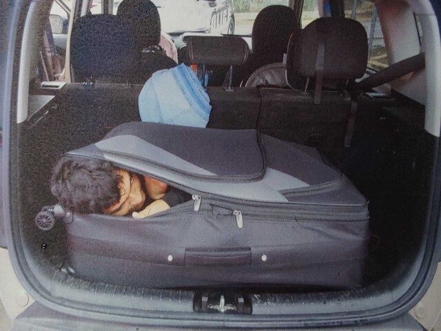 Migrant in Suitcase