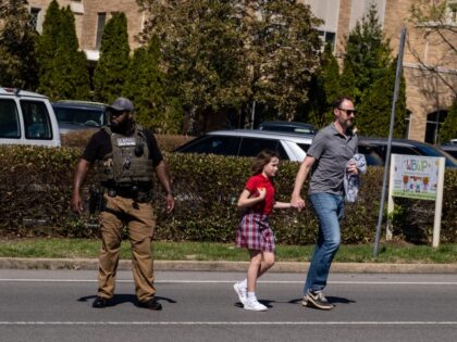 NASHVILLE, TN - MARCH 27: A parent walks with their child from Woodmont Baptist Church whe