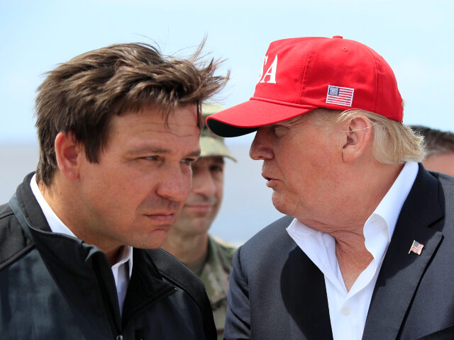 FILE - President Donald Trump talks to Florida Gov. Ron DeSantis, left, during a visit to Lake Okeechobee and Herbert Hoover Dike at Canal Point, Fla., March 29, 2019. Allies of former President Donald Trump have filed a complaint with the Florida Commission on Ethics accusing the state’s governor, Ron …