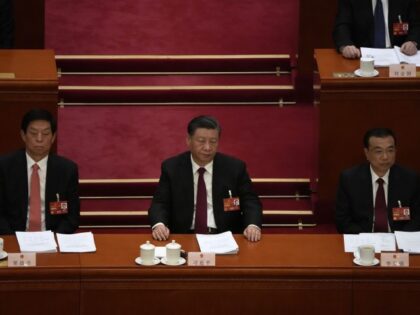 From left, Li Zhanshu, Chinese President Xi Jinping, and Premier Li Keqiang attend the ope