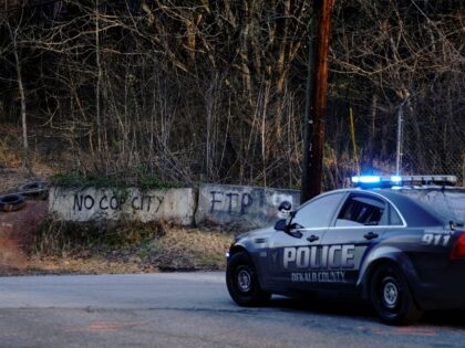 Law enforcement drive past the planned site of a police training facility that activists have nicknamed "Cop City", following the first raid since the death of environmental activist Manuel Teran near Atlanta, Georgia, on February 6, 2023. - Teran was allegedly shot by police on January 18, 2023, during a …