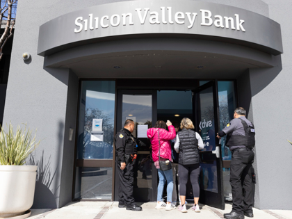 Security guards let individuals enter the Silicon Valley Bank's headquarters in Santa Clar
