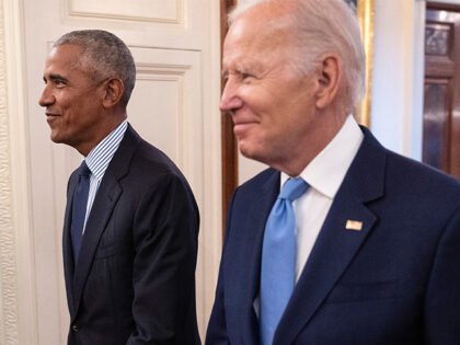 Former President Barack Obama and President Joe Biden arrive at a ceremony to unveil the o