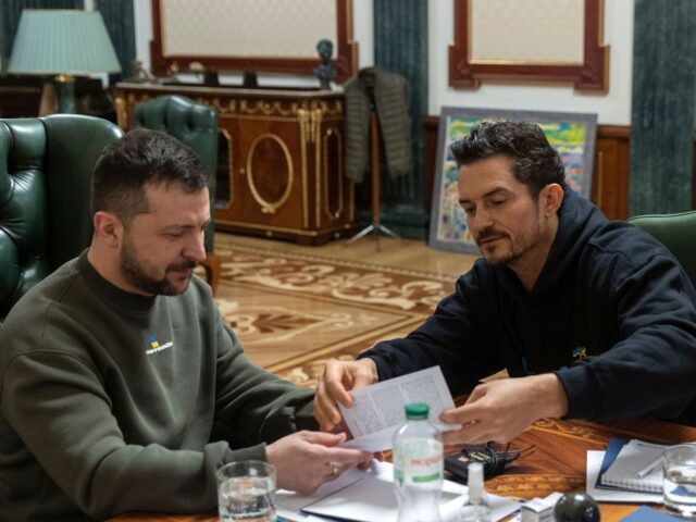 In this photo provided by the Ukrainian Presidential Press Office, Ukrainian President Volodymyr Zelenskyy, left, speaks with British actor and UNICEF Goodwill Ambassador Orlando Bloom during their meeting in Kyiv, Ukraine, Sunday, March 26, 2023. (Ukrainian Presidential Press Office via AP)