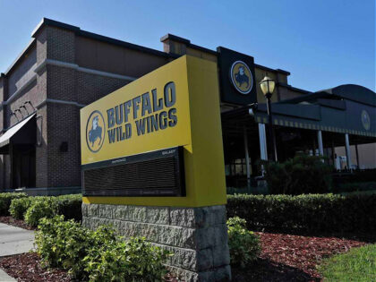 A Buffalo Wild Wings restaurant is shown Tuesday, Nov. 28, 2017, in Valrico, Fla. Fast food chain Arby's is buying Buffalo Wild Wings. The deal is expected to close in 2018's first quarter. It still needs the approval of Buffalo Wild Wings shareholders. (AP Photo/Chris O'Meara)