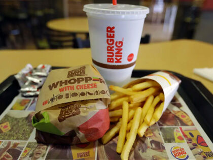 A bacon Whopper with cheese meal sits on a table at a Burger King on Wednesday, Oct. 26, 2