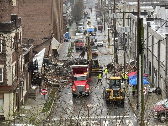 Emergency responders and heavy equipment are seen at the site of a deadly explosion at a chocolate factory in West Reading, Pennsylvania, Saturday, March 25. (Michael Rubinkam/AP)