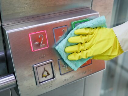 27 May 2020, Saxony, Leipzig: A DB employee cleans and disinfects an elevator at Leipzig central station. With more disinfectant hand dispensers, more frequent cleaning and virus-killing light, Deutsche Bahn wants to prepare itself for the growing passenger traffic in the corona crisis at the stations. With new cleaning machines, …