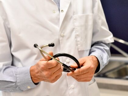 Illustration shows a close up on a doctor holding his stethoscope during a consultation in a group medical practice of general practitioners in Ronse, Monday 27 April 2020. BELGA PHOTO DIRK WAEM (Photo by DIRK WAEM/BELGA MAG/AFP via Getty Images)
