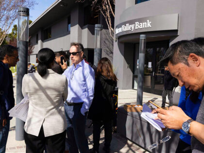 FDIC member Dedra Dorn (Center Left) speaks with individuals in line outside Silicon Valle