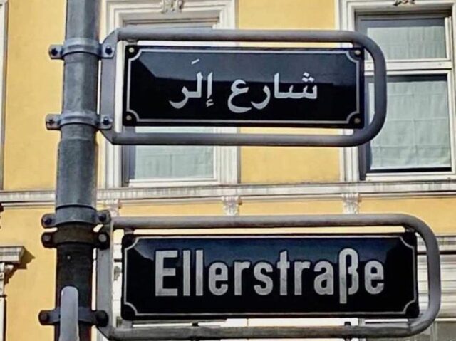 Leftward-leaning German politicians have lauded the decision to erect the nation’s first street sign in Arabic script as a “a symbolic expression of social inclusion.”