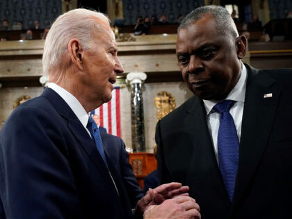 US President Joe Biden, left, speaks to Lloyd Austin, US secretary of defense, after delivering the State of the Union address at the US Capitol in Washington, DC, US, on Tuesday, Feb. 7, 2023. Biden is speaking against the backdrop of renewed tensions with China and a brewing showdown with …