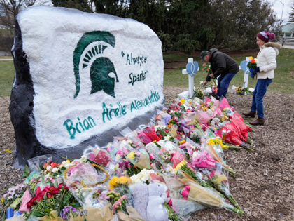 Mourners leave flowers at The Rock on the grounds of Michigan State University in East Lansing, Mich., Wednesday, Feb. 15, 2023. Alexandria Verner, Brian Fraser and Arielle Anderson were killed and several other students remain in critical condition after a gunman opened fire on the campus of Michigan State University …