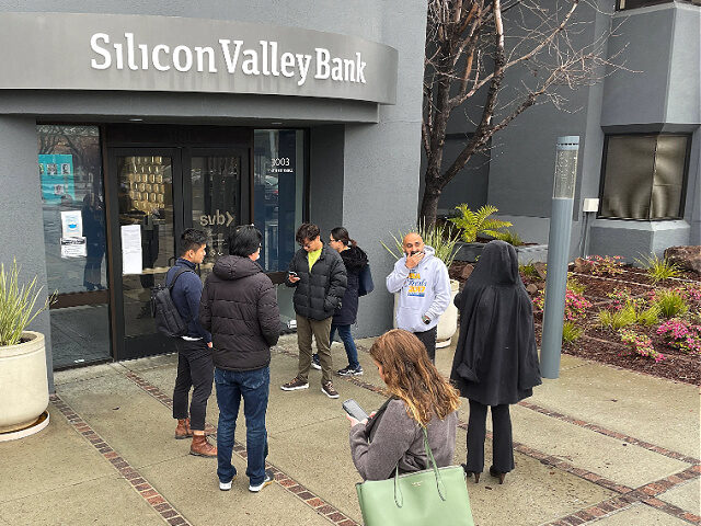 SANTA CLARA, CALIFORNIA - MARCH 10: People line up outside of the shuttered Silicon Valley Bank (SVB) headquarters on March 10, 2023 in Santa Clara, California. Silicon Valley Bank was shut down on Friday morning by California regulators and was put in control of the U.S. Federal Deposit Insurance Corporation. …