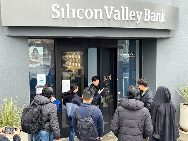 A worker (center) tells people that the Silicon Valley Bank (SVB) headquarters is closed on March 10, 2023 in Santa Clara, California. Silicon Valley Bank was shut down on Friday morning by California regulators and was put in control of the U.S. Federal Deposit Insurance Corporation. (Justin Sullivan/Getty Images)