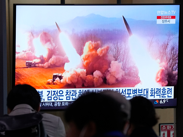 A TV screen shows an image of North Korea's missiles launch during a news program at the S