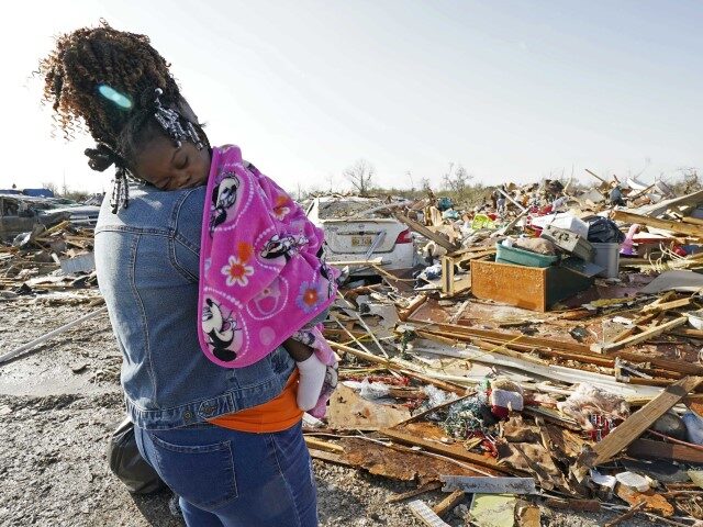 Wonder Bolden cradles her year-old granddaughter Journey Bolden as she surveys the remains of her mother's tornado demolished mobile home in Rolling Fork, Miss., Saturday, March 25, 2023. Emergency officials in Mississippi say several people have been killed by tornadoes that tore through the state on Friday night, destroying buildings …