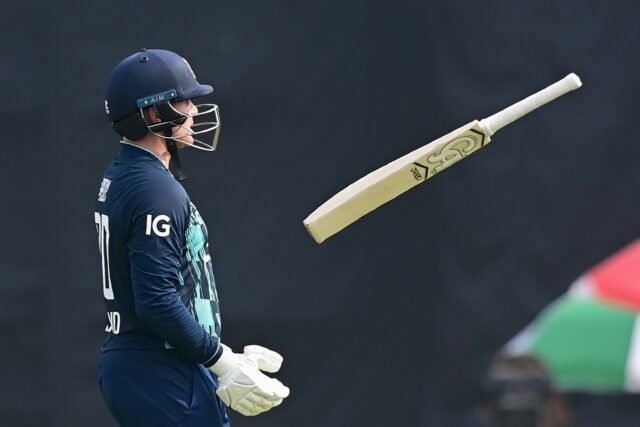 England’s Jason Roy plays with his bat he walks off the field after being dismissed
