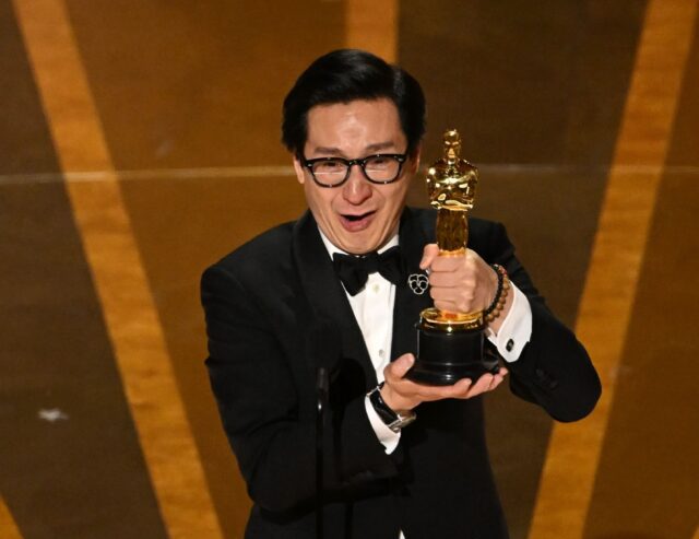 Ke Huy Quan accepts the Oscar for best supporting actor for "Everything Everywhere All at