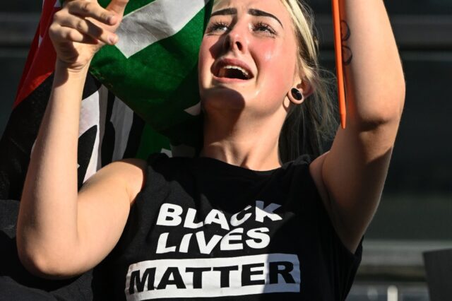 A protester wearing a "Black Lives Matter" T-shirt takes part in a racial justrice demonst