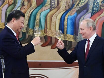 TOPSHOT - Russian President Vladimir Putin and China's President Xi Jinping make a toast during a reception following their talks at the Kremlin in Moscow on March 21, 2023. (Photo by Pavel Byrkin / SPUTNIK / AFP) (Photo by PAVEL BYRKIN/SPUTNIK/AFP via Getty Images)