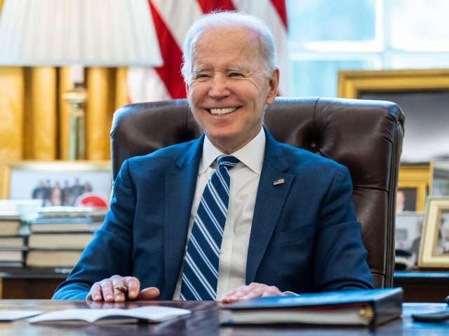 President Joe Biden talks with staff before a call with Ukrainian President Volodymyr Zelenskyy, Thursday, April 14, 2022, in the Oval Office. (Official White House Photo by Adam Schultz)