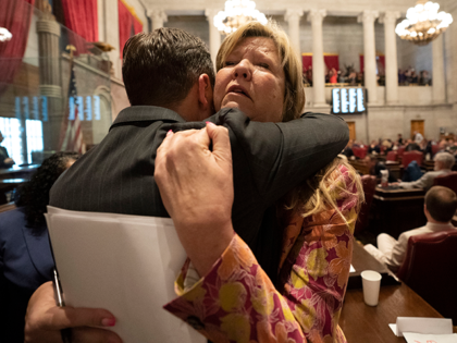 Rep. Gloria Johnson, D-Knoxville, right, receives a hug from Rep. John Ray Clemmons, D-Nashville, on the floor of the House chamber after a resolution to expel Johnson from the legislature failed Thursday, April 6, 2023, in Nashville, Tenn. Tennessee Republicans were seeking to oust three House Democrats including Johnson for …