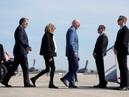 President Joe Biden walks to board Air Force One, Tuesday, April 11, 2023, with his son Hu