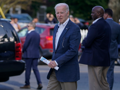 President Joe Biden walks from St. Edmond Roman Catholic Church after attending Mass in Re