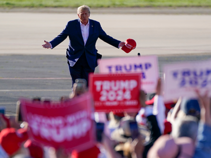 Former President Donald Trump walks across the tarmac as he arrives to speak at a campaign rally at Waco Regional Airport Saturday, March 25, 2023, in Waco, Texas. Trump’s campaign reported raising more than $18.8 million between his main campaign account and a joint fundraising account over the first three …