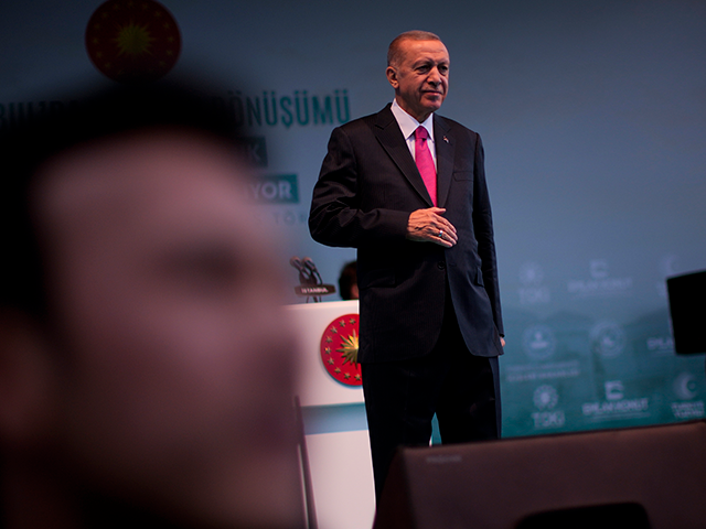 Turkish President and People's Alliance's presidential candidate Recep Tayyip Erdogan give