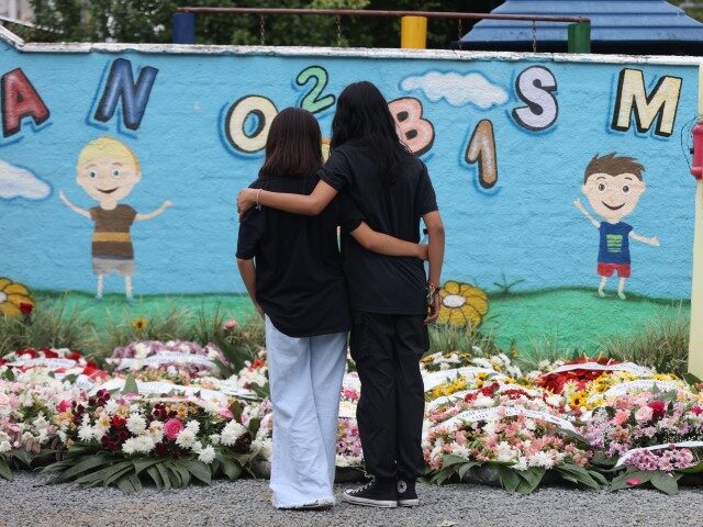 BRAZIL-CRIME-VIOLENCE-ATTACK-PRESCHOOL-VIGIL People take part in a vigil outside the Good