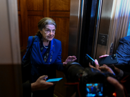 WASHINGTON, DC - FEBRUARY 14: Sen. Dianne Feinstein (D-CA) is mobbed by reporters as she enters an elevator at the U.S. Capitol on February 14, 2023 in Washington, D.C. Feinstein announced that she will not seek reelection. (Photo by Ricky Carioti/The Washington Post via Getty Images)