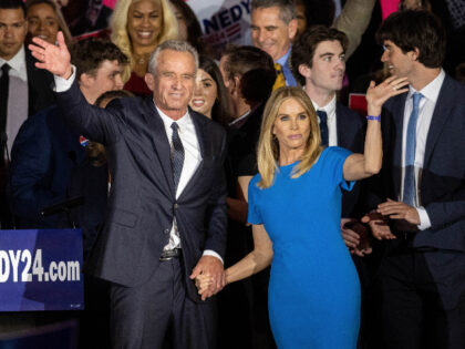 BOSTON, MA - APRIL 19: Robert F. Kennedy Jr. and his wife Actress Cheryl Hines wave to sup
