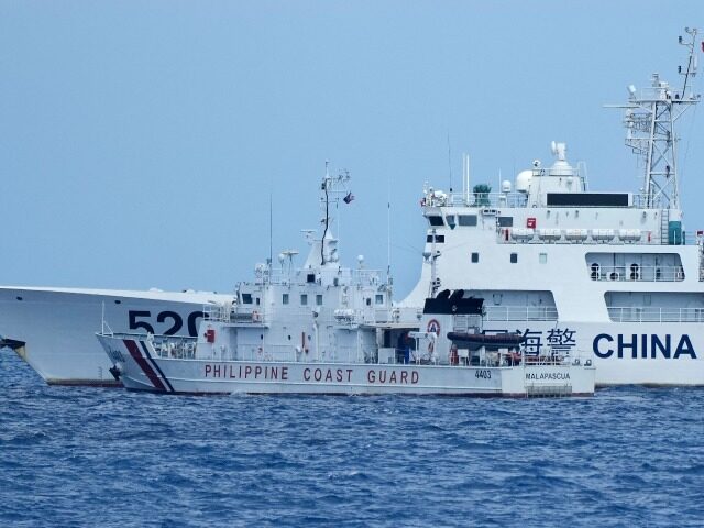 A Chinese Coast Guard ship with bow number 5201 blocks Philippine Coast Guard ship BRP Mal
