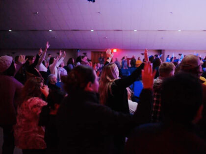 Attendees at Christ Church in Cape Girardeau, MO, lift their hands in worship (Facebook/Christ Church)