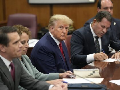 Trump Indictment Former President Donald Trump sits at the defense table with his defense