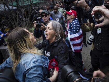 Protesters argue at the Collect Pond Park across the street from the Manhattan District At