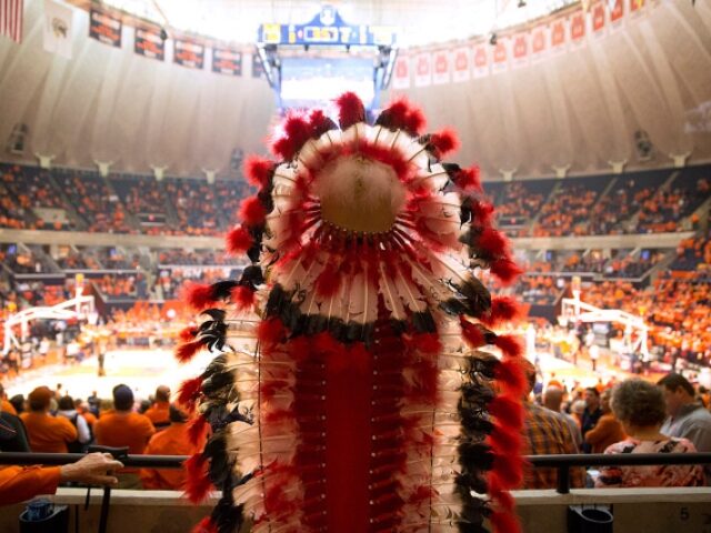 Student Omar Cruz, 20, inside the State Farm Center as he portrays Chief Illiniwek during halftime at a University of Illinois basketball game on February 28, 2016, in Champaign, Ill. Chief Illiniwek was the official mascot of the University of Illinois at Urbana-Champaign, but was retired in 2007 after controversy …