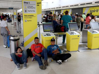 Jose santos Garsia, Oilman Josue Lopez Flores , and Misael Vasquez Munguia relax as they wait to hear when they can continue their journey to North Carolina after the Fort Lauderdale-Hollywood International Airport was closed due to the flooded runways on April 13, 2023 in Fort Lauderdale, Florida. The heavy …