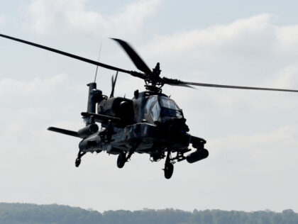 An American Apache helicopter in the skies over Waabs, Germany, 15 May 2017. Around 3,500 Nato soldiers are participating in military manoeuvres in the area as part of the Red Griffin/Colibri 50 exercises. Photo: Carsten Rehder/dpa (Photo by Carsten Rehder/picture alliance via Getty Images)