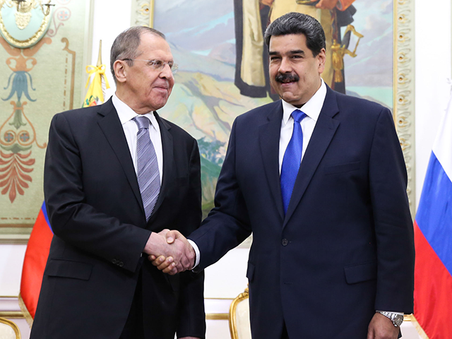 Russian Foreign Minister Sergey Lavrov (L) meets with Venezuelan President Nicolas Maduro